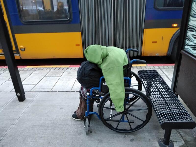 Homeless man in wheelchair, a few blocks from the headquarters of Amazon.com