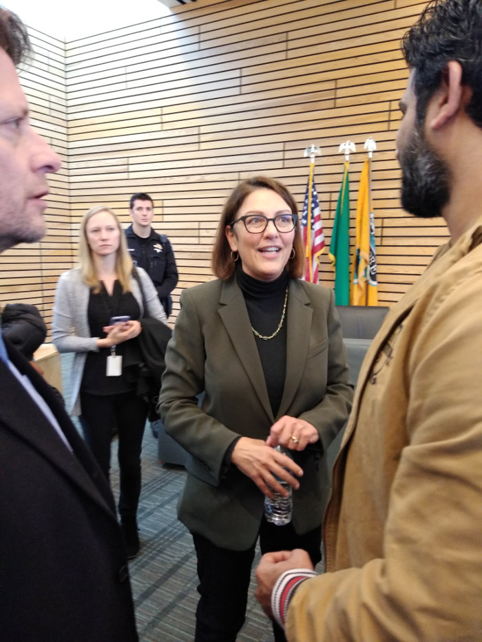 Rep. Suzan DelBene speaking with a constituent on Nov 11, 2019 at a town hall in Kenmore, WA